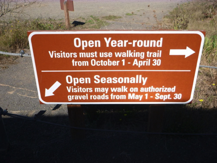 Signage at the top of Cutoff Trail - Open Year-round [trail to right] - Open Seasonally [trail to left]